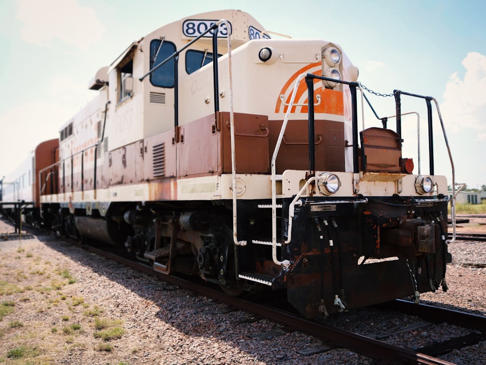 white and brown train at daytime