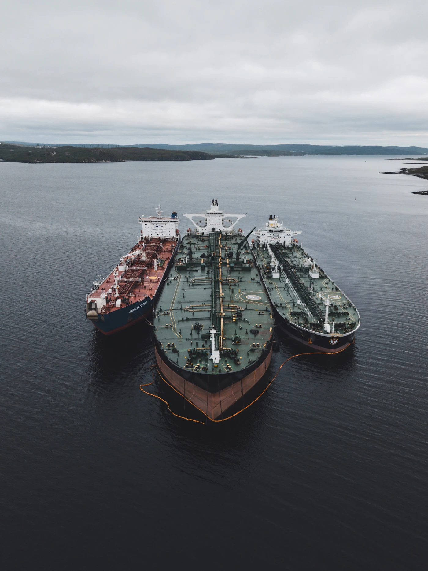 Ships at sea under a cloudy sky
