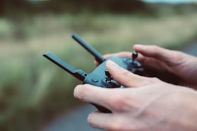 selective focus photography of remote control