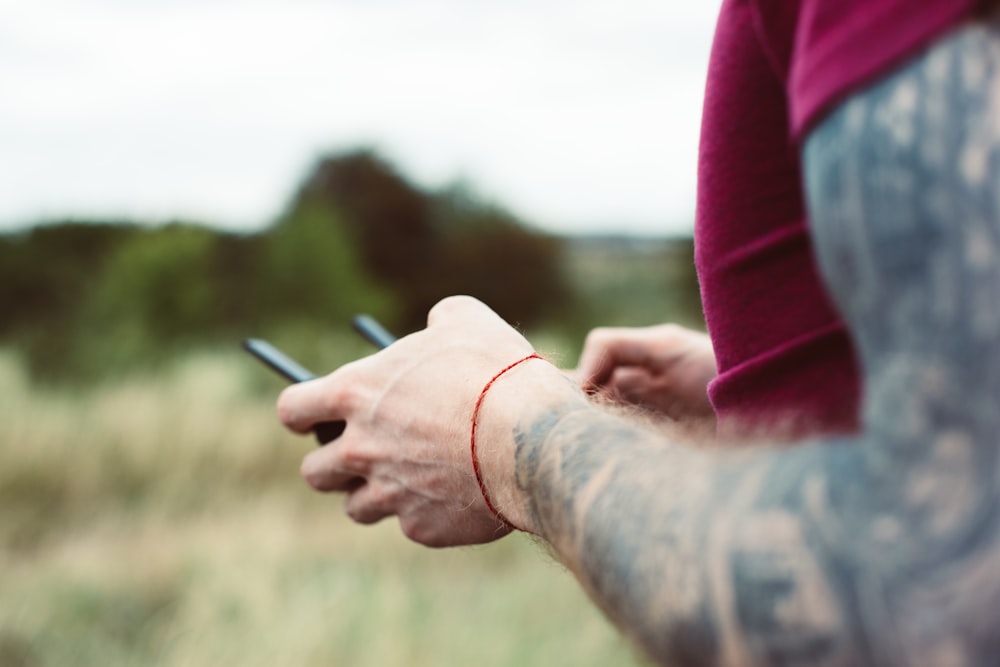 man holding drone remote