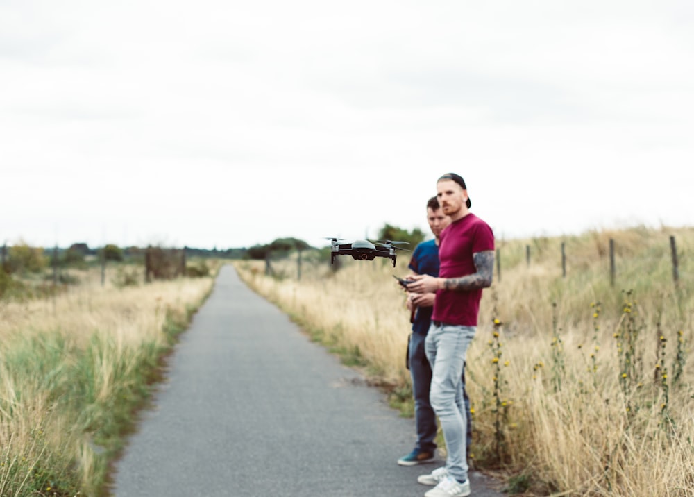 two men standing on pathway