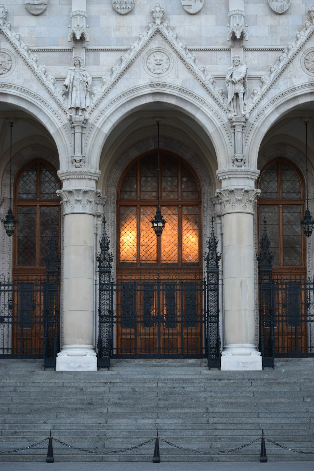 black metal gate near white building