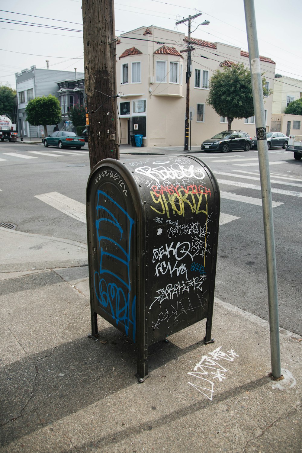 black mailbox beside post