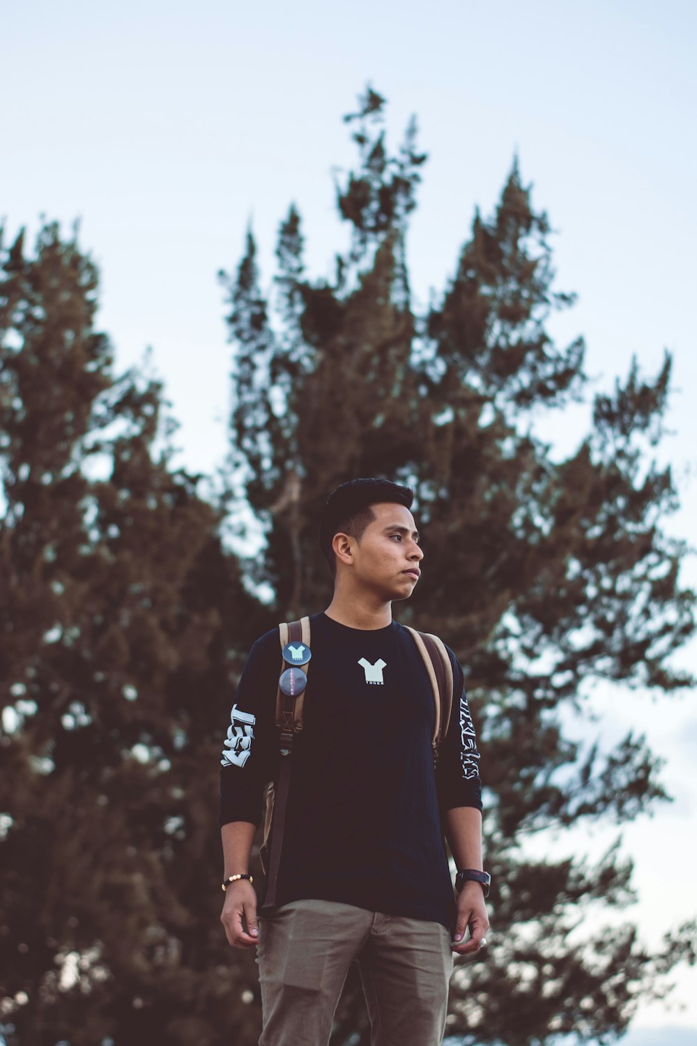 man standing near tree