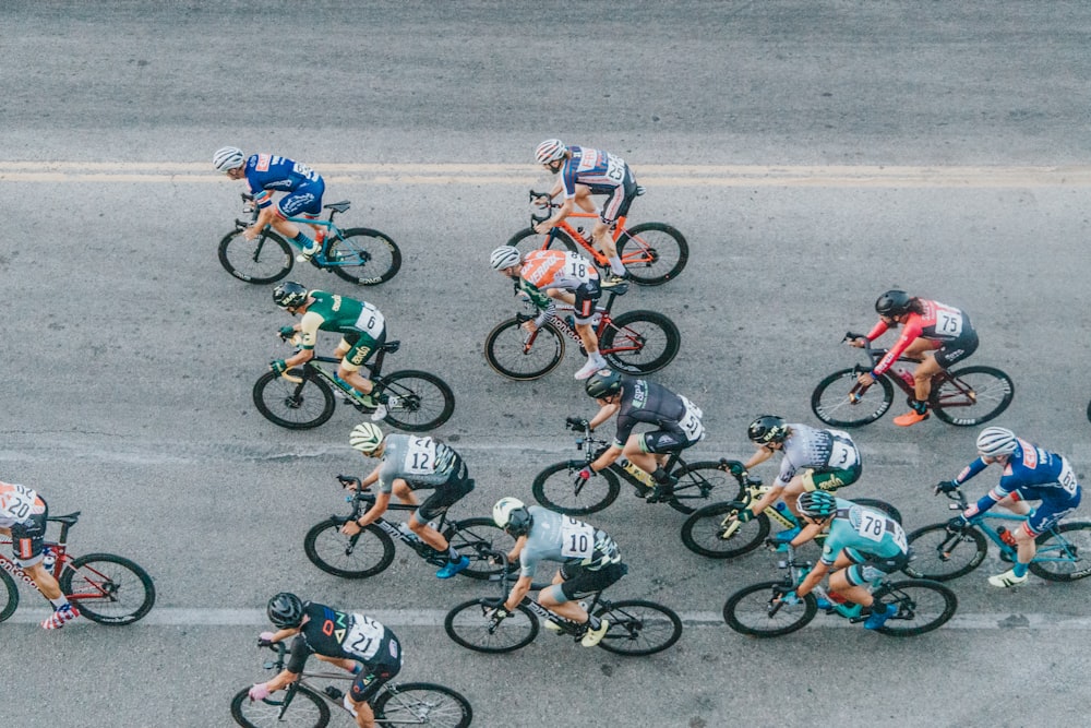 group of men riding bicycles