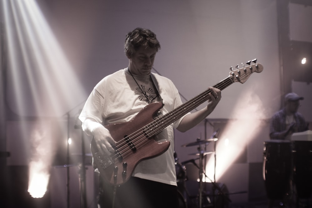 man playing bass guitar