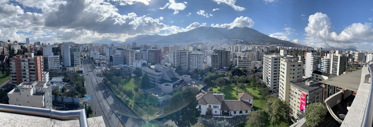 A panoramic view of Burundi’s capital city blending modern architecture with traditional design elements under a bright afternoon sky.
