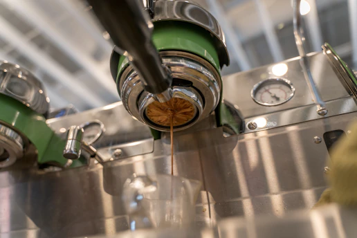 Close-up of a sleek automatic coffee machine brewing a fresh cup of coffee.