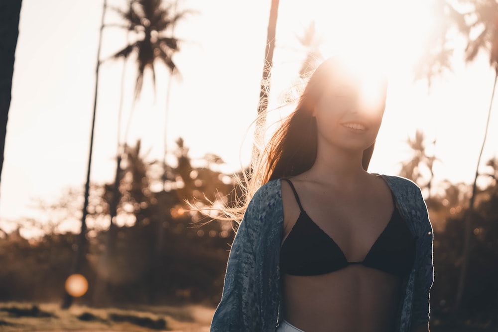 woman wears black bikini