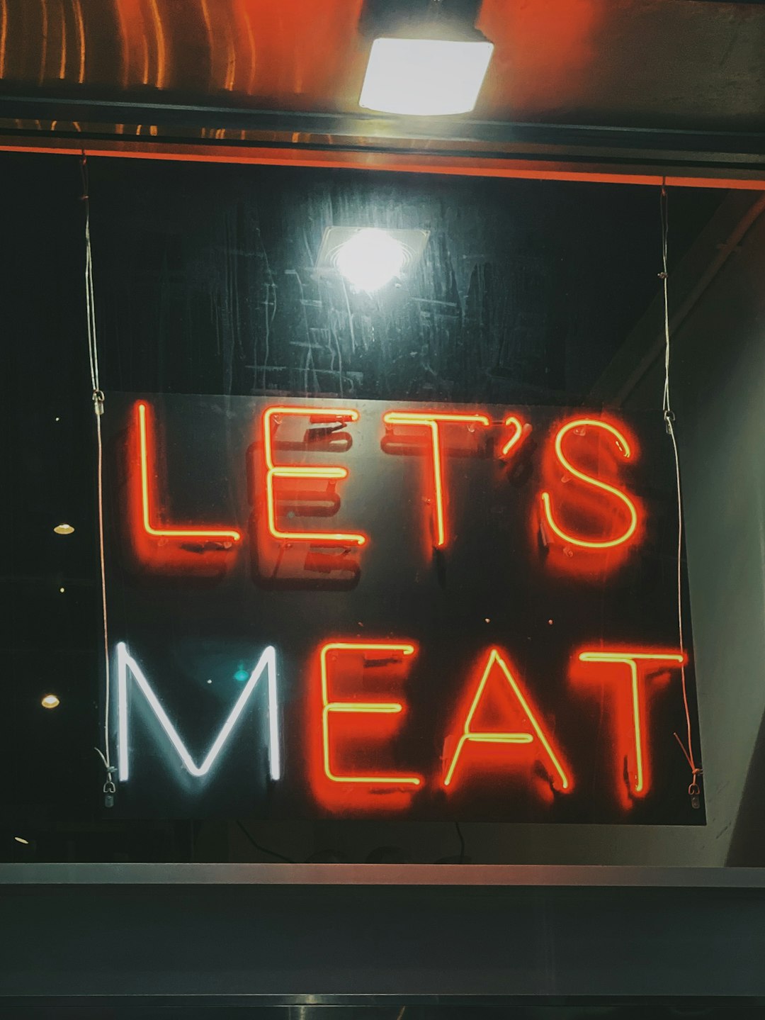 red Let's Meat neon signage