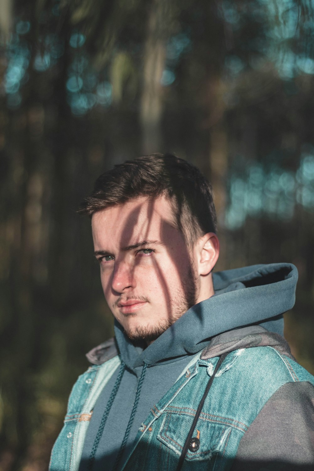 man wears blue pullover hoodie