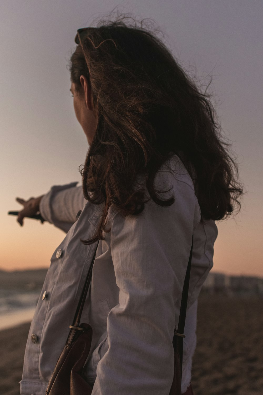 woman pointing left hand