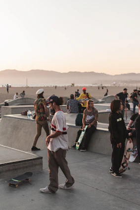 A candid photo of the Sentra Skate team hanging out at a skatepark, boards in hand, smiling and ready to ride.