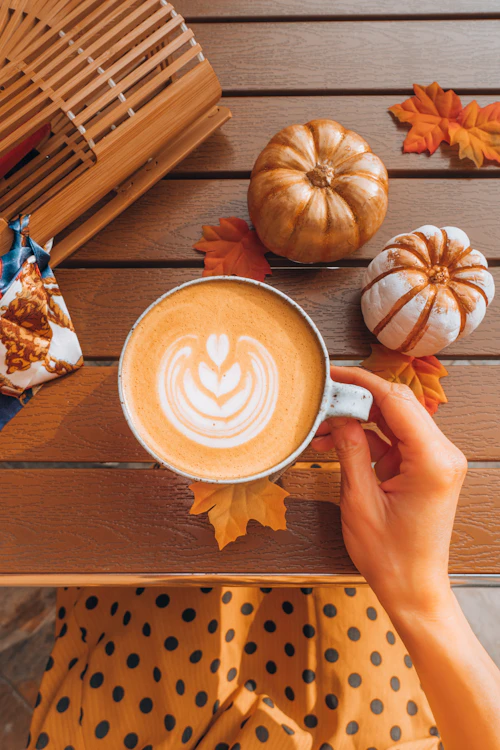 Pumpkin latte in hands
