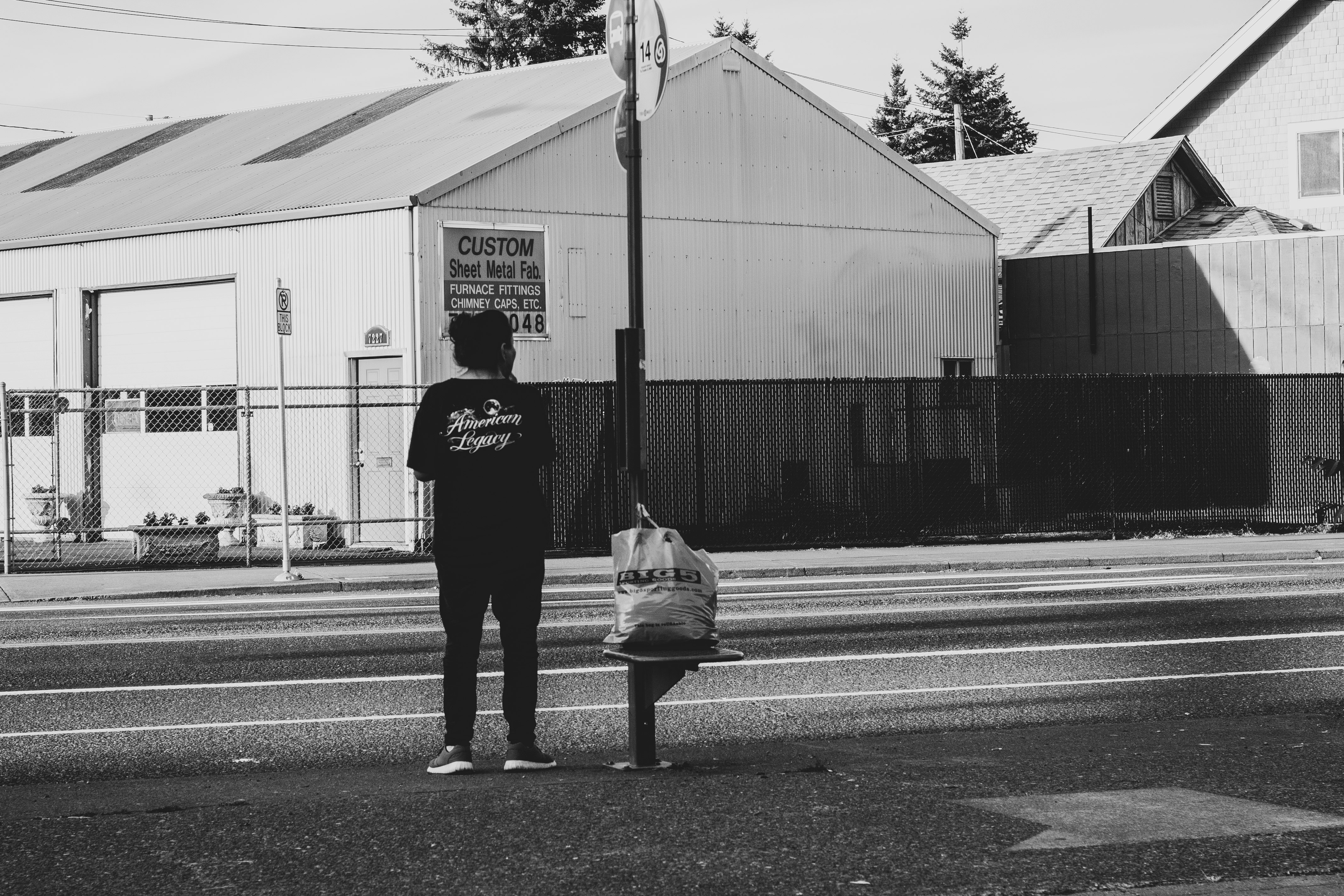 person standing near road