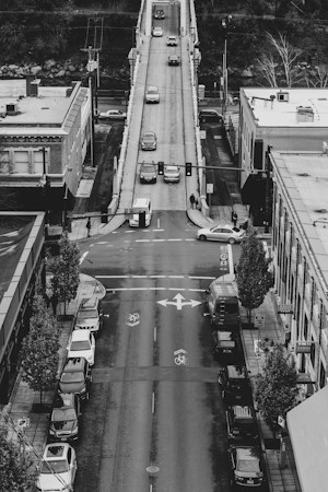 Black and white aerial view of cars moving along a busy multi-lane street, like the extra traffic that could shift to Lake Mead Boulevard