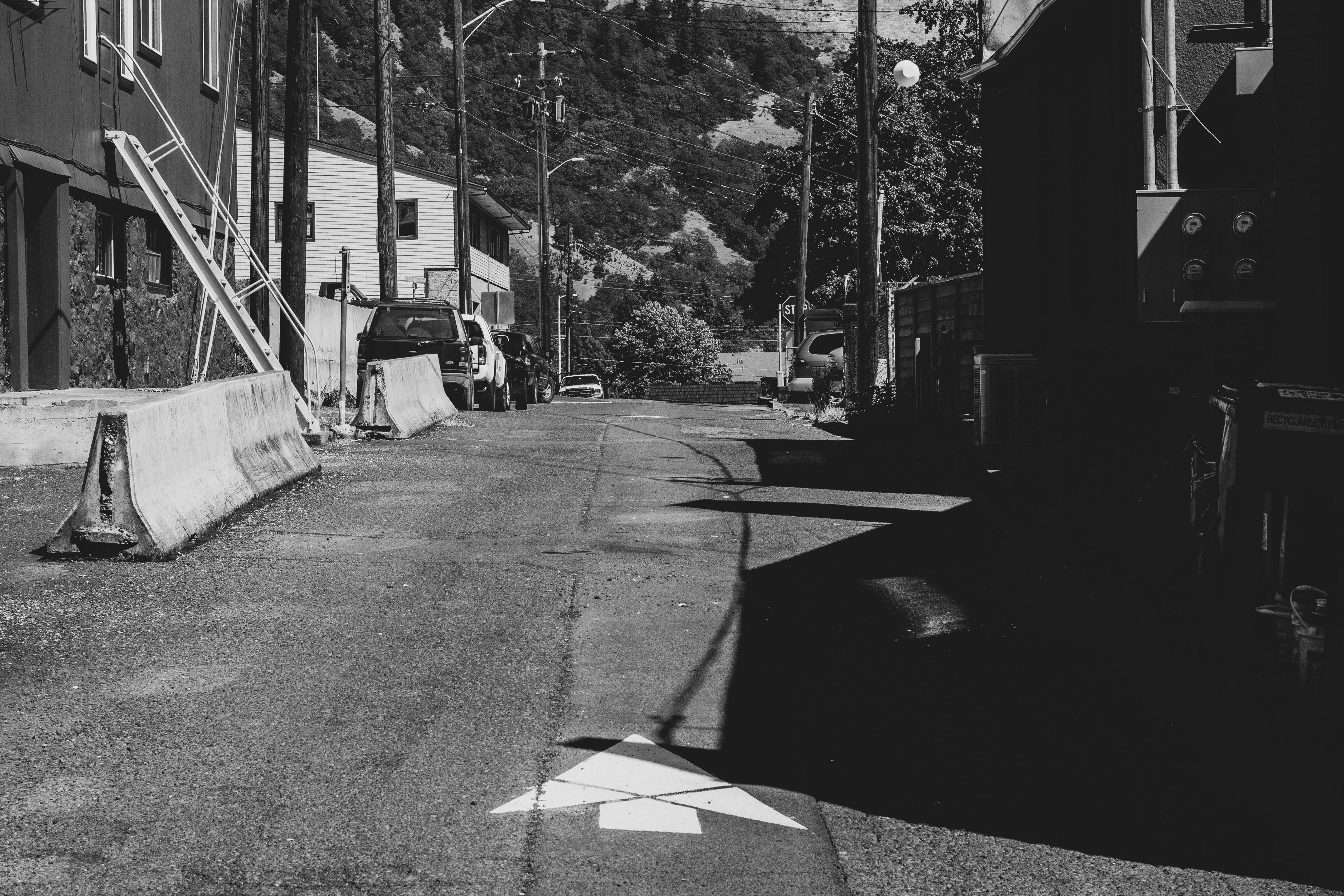 a black and white photo of an empty street