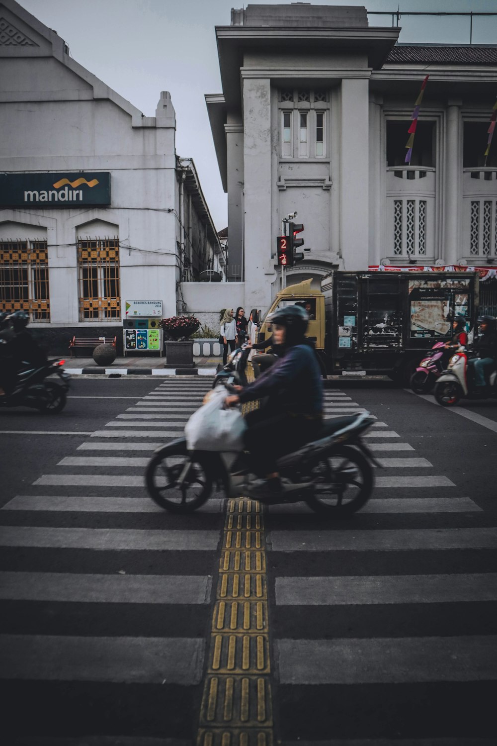 man wearing black jacket riding on motorcycle