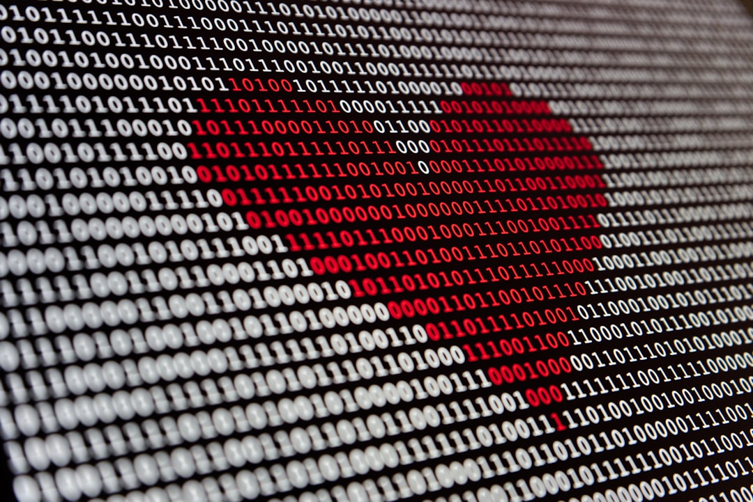 a heart is shown on a computer screen, Red heart made out of binary digits