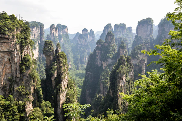Misty mountain ridge and forest river valley in Hunan