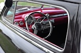 An interior view of a vintage car highlighting its unique features.