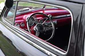 An interior view of a vintage car highlighting its unique features.