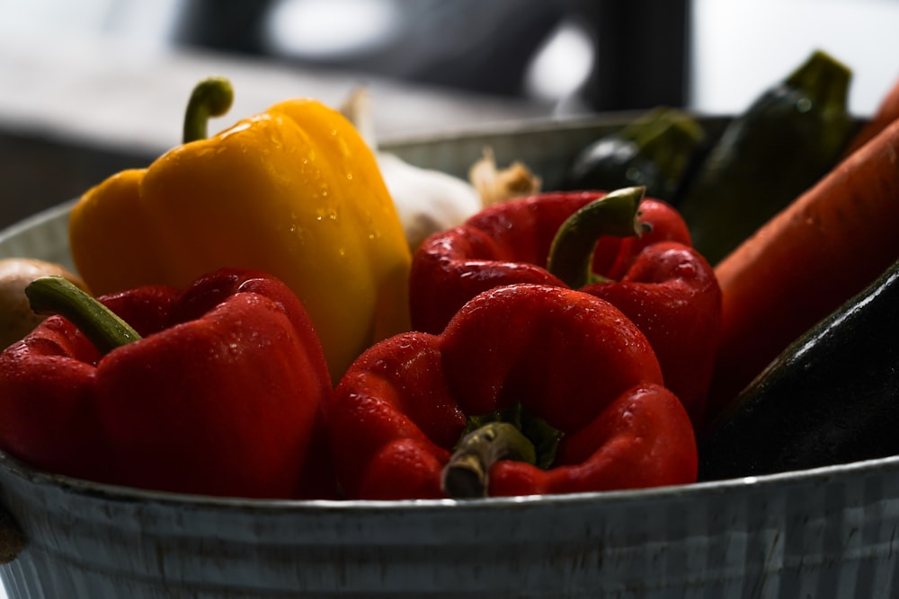 basin of variety colored bell peppers