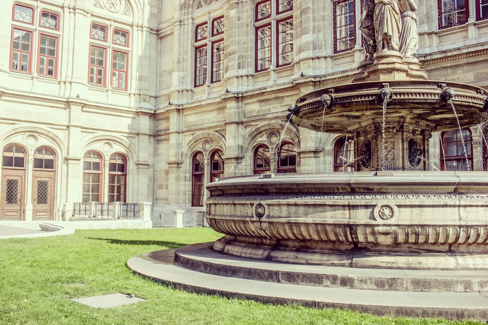 gray outdoor water fountain near building