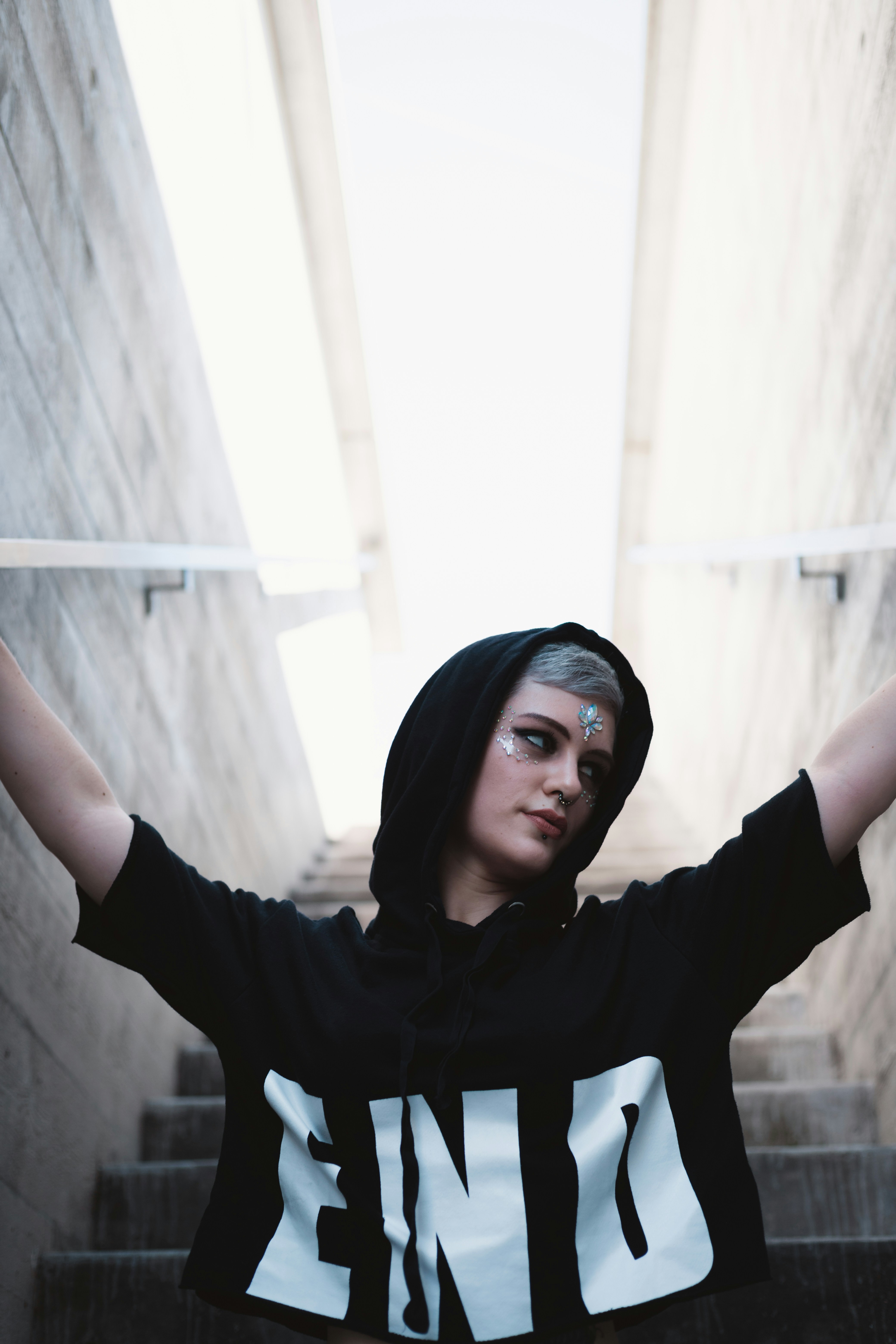 Pretty young lady is modeling on the street.