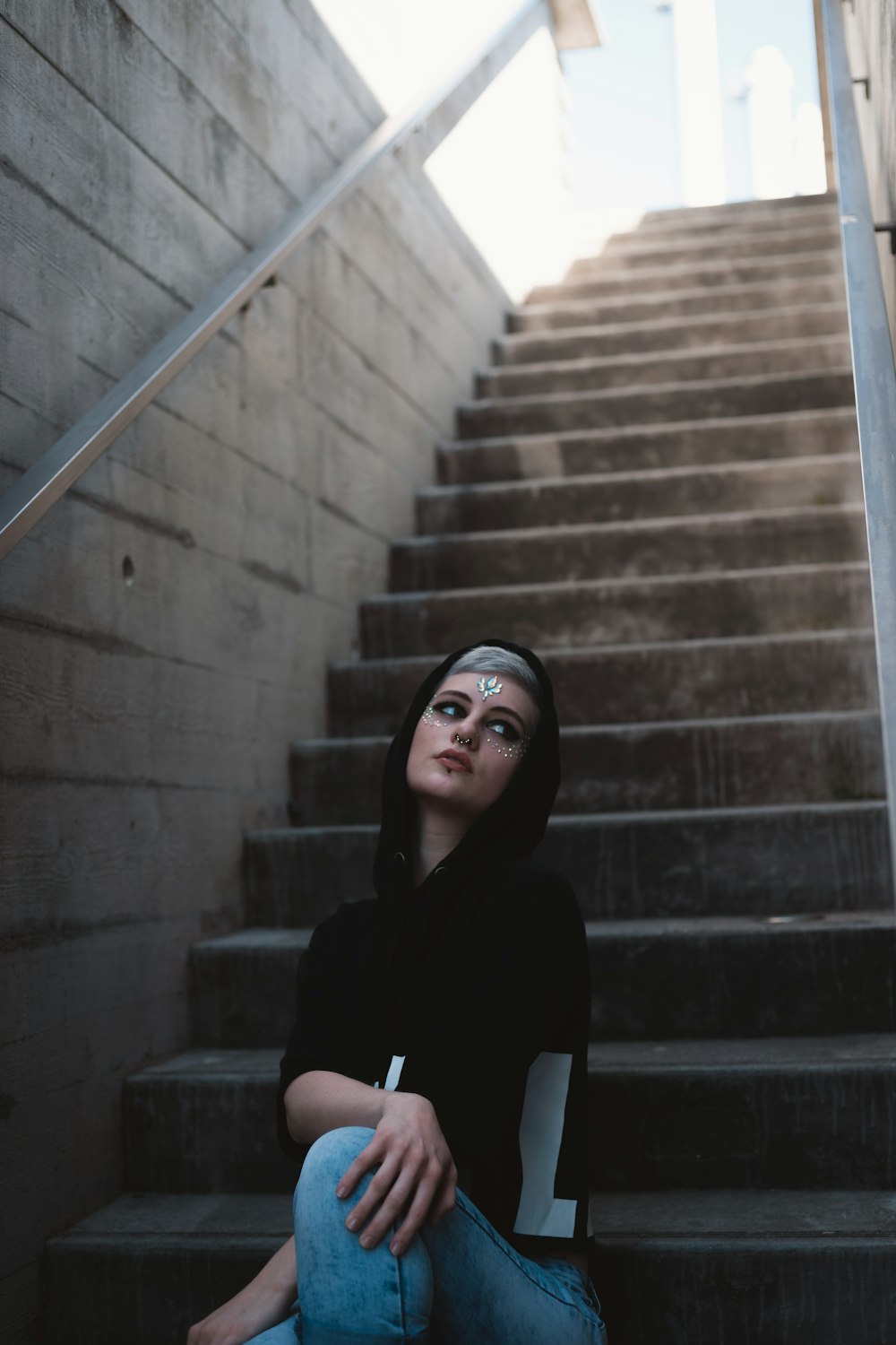 woman sits on stairs