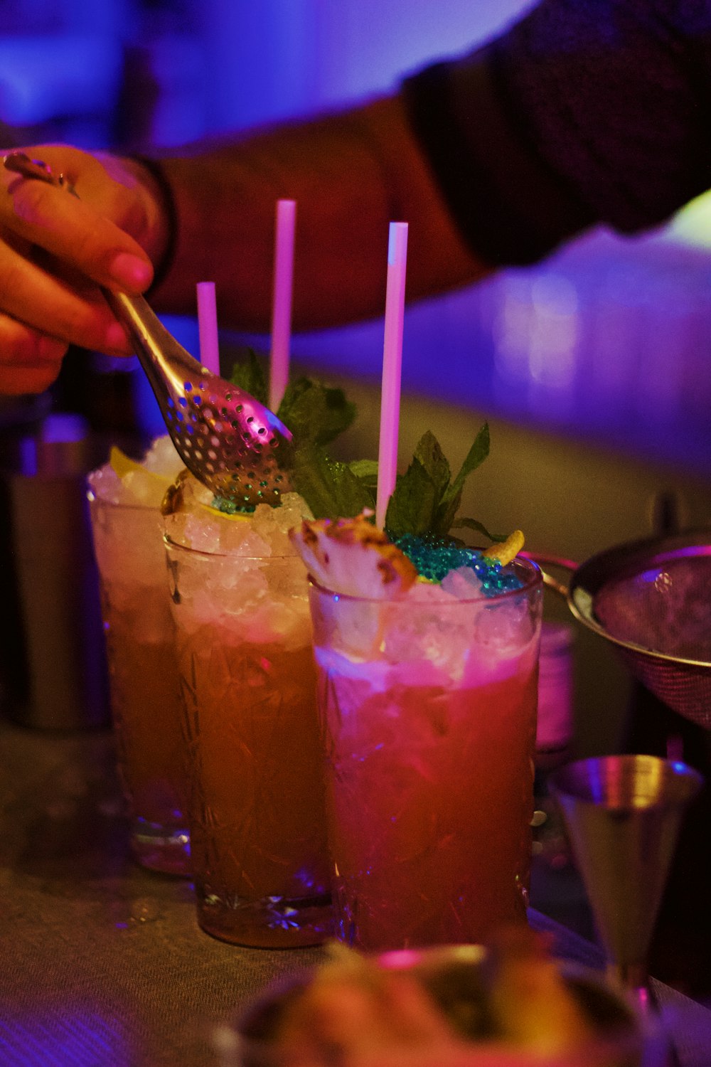 a close up of two drinks on a table