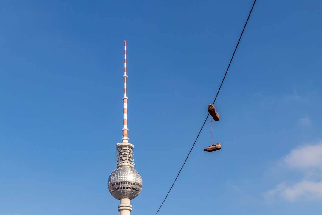 pair of brown shoes on cable wire