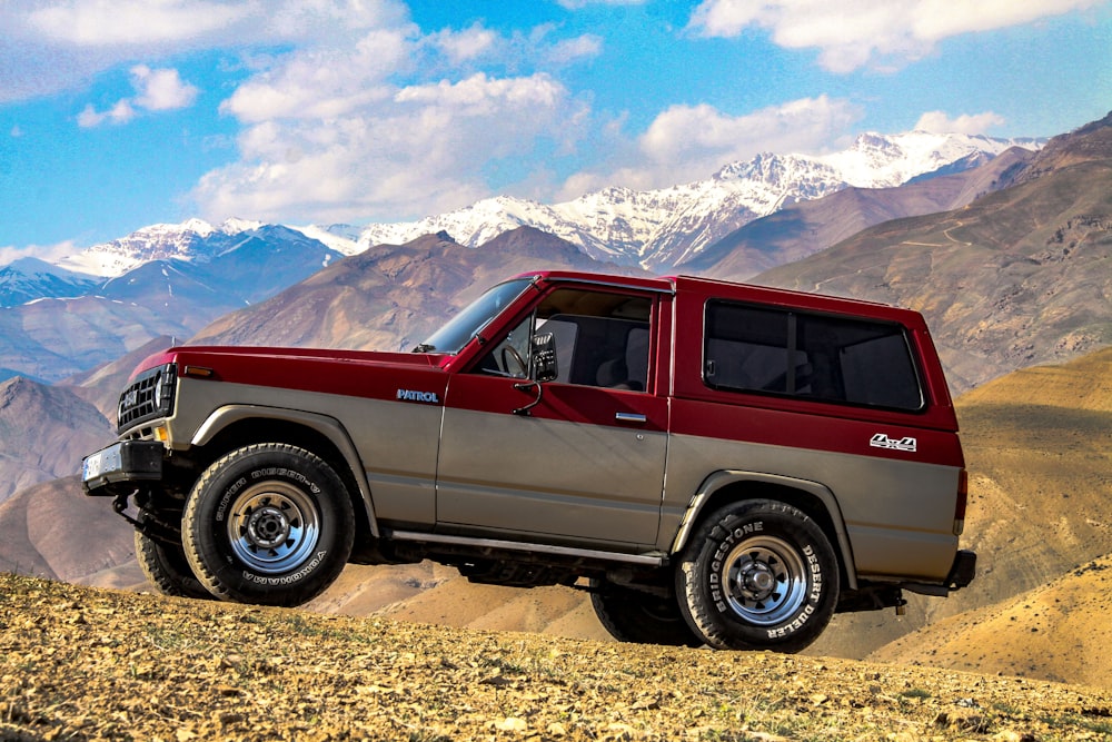 red and silver Isuzu Highlander SUV