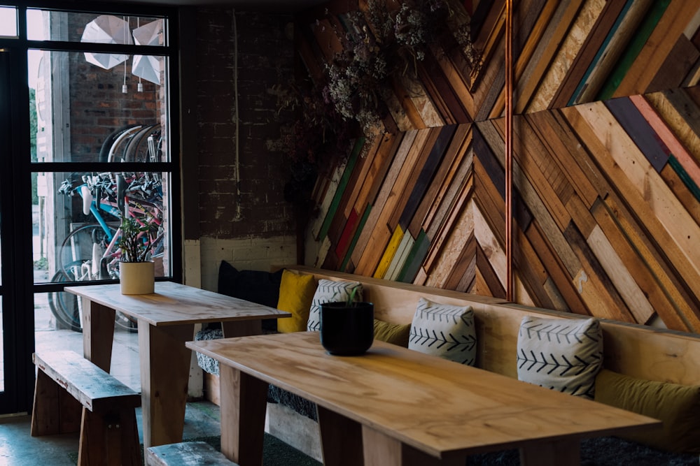 rectangular brown wooden dining table inside building