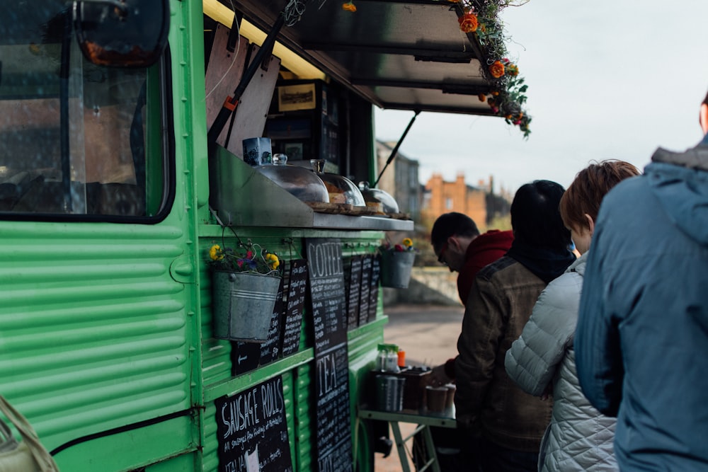 people falling in line on food truck