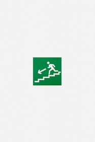 A green emergency exit sign featuring a white pictogram of a person descending stairs with an arrow pointing downwards and to the left.