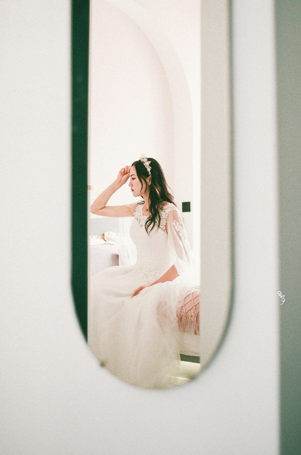 woman sitting on bed