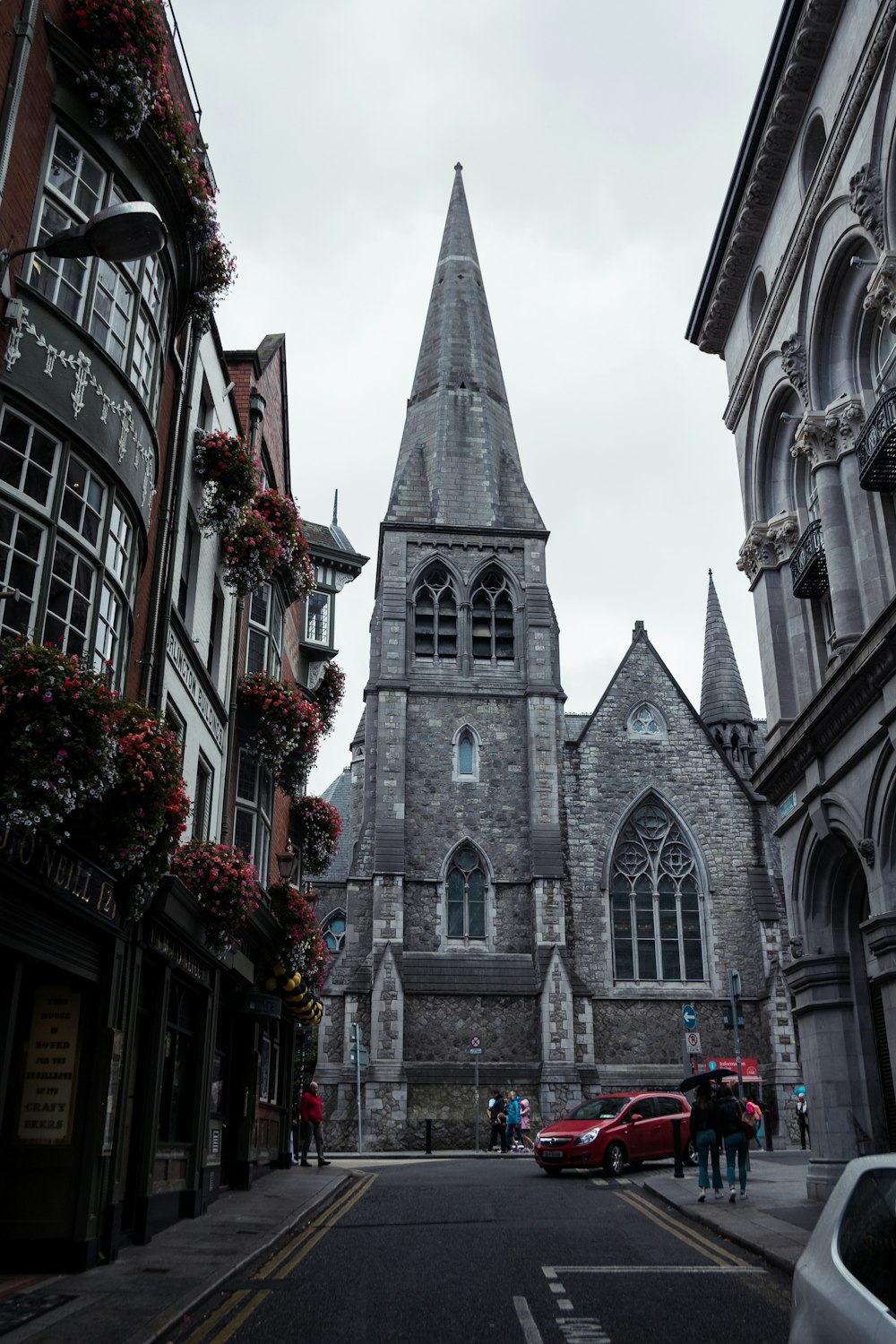 vehicle about to pivot on a street beside a cathedral