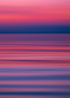 An abstract horizon where color and light blend to suggest a timeless, spiritual space.