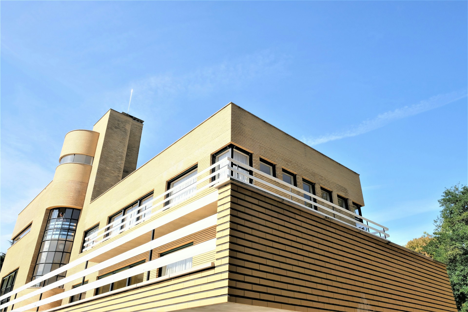 Exterior view of a Buckwings residential building showcasing clean architectural lines and landscaped surroundings.