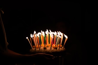 lighted candles on cake