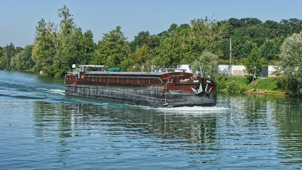 passenger vessel passing by a river