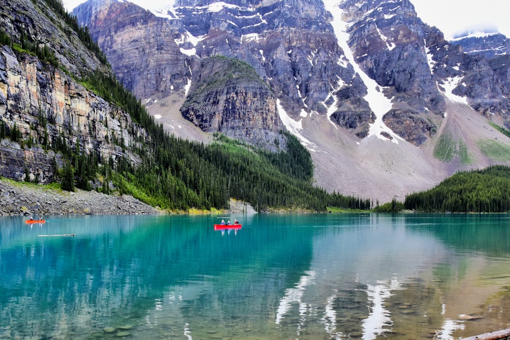 blue lake surrounded by mountains