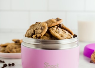 bunch of cookies in pink food container