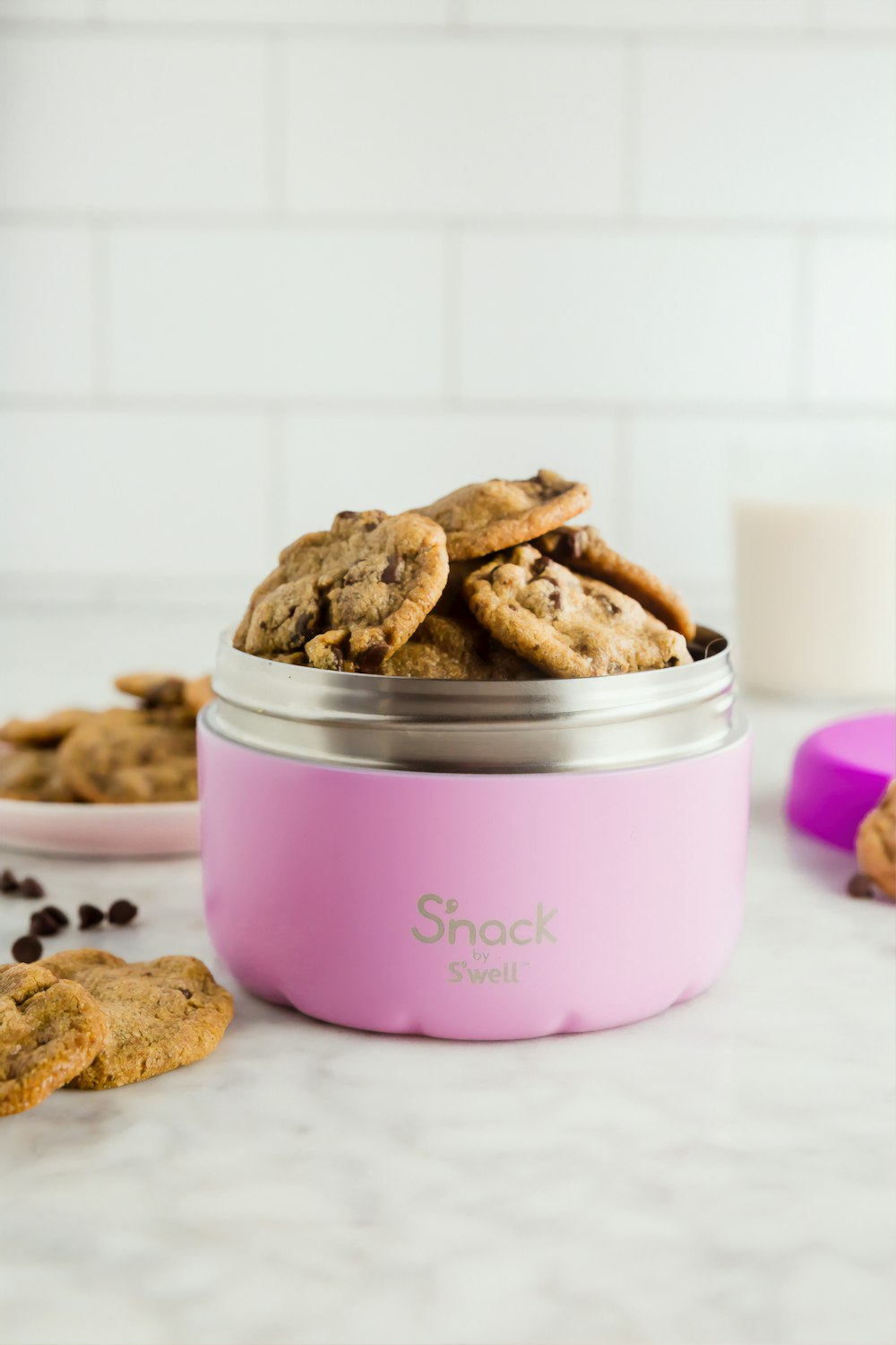 bunch of cookies in pink food container