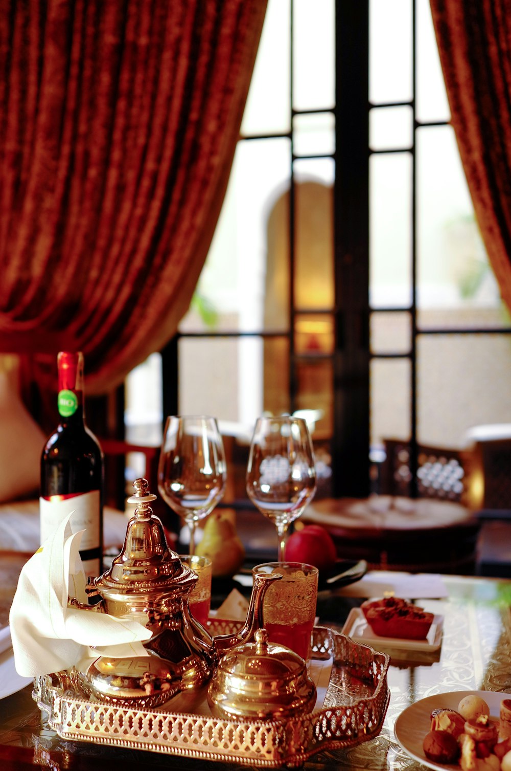 wine glasses and wine bottle on a dining table