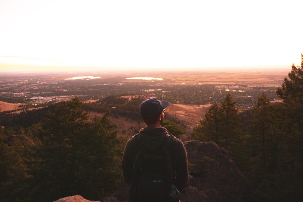 man stands near foret