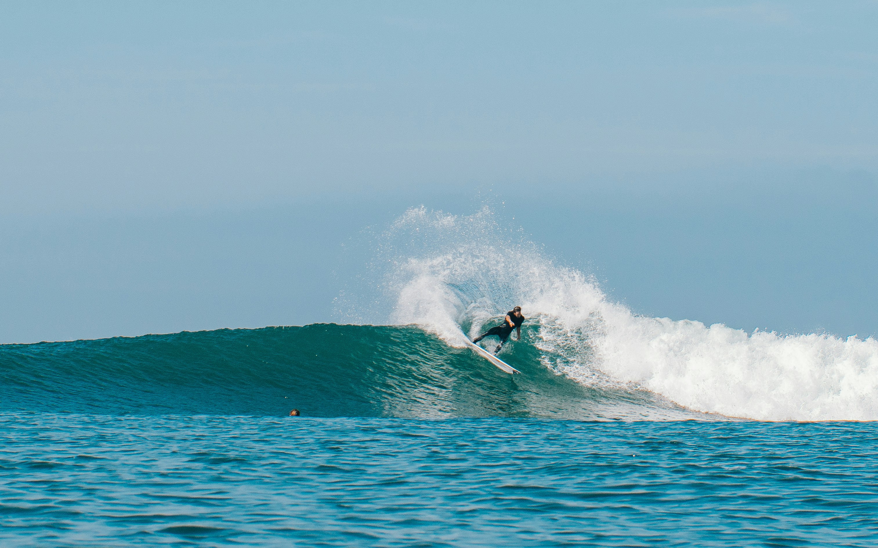 person surfing on sea