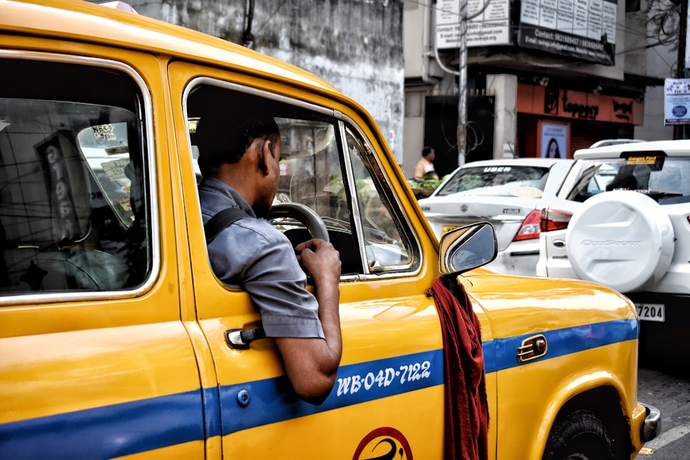 man riding vehicle during daytime