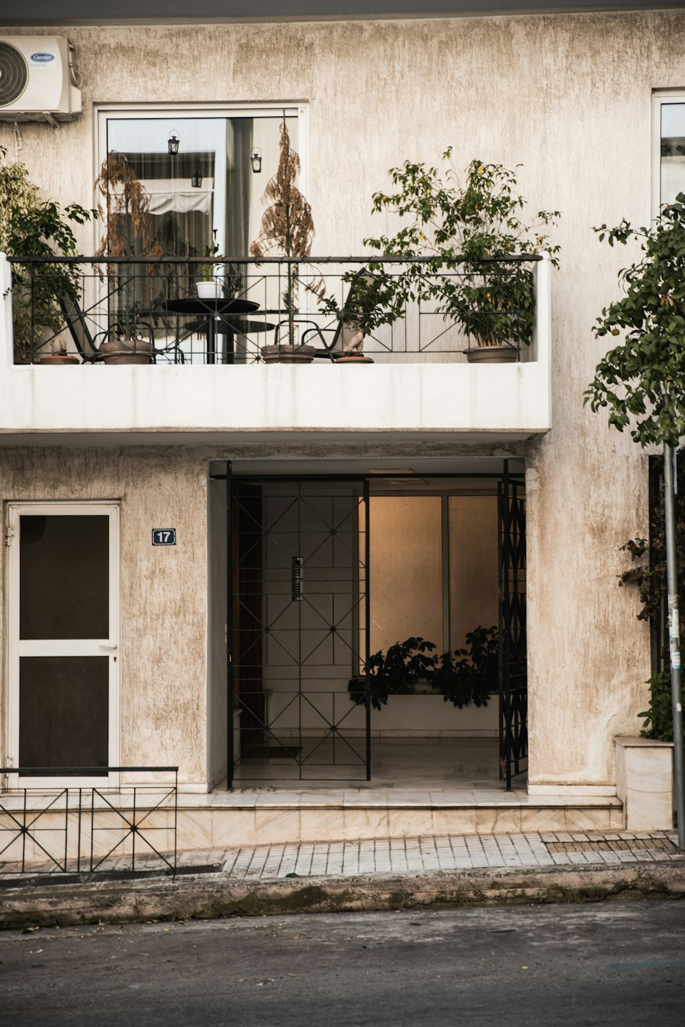 building with opened gate and balcony during day